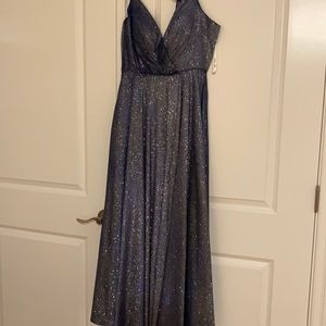 Shimmering blue full skirt, bustles. Matching bow tie.